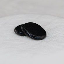 Load image into Gallery viewer, Black Tourmaline Palm Stone on a white cloth - Down to Earth 
