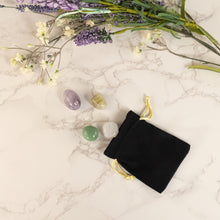 Load image into Gallery viewer, Black &amp; Gold Drawstring Bag top down with crystal and plants displayed on a styled background - Down To Earth
