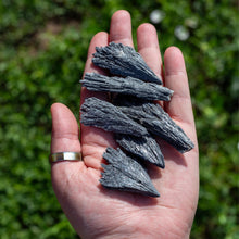 Load image into Gallery viewer, Black Kyanite Blade in the palm of a hand - Down To Earth
