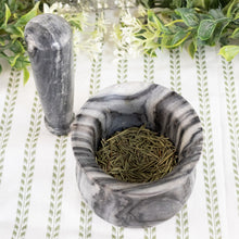 Load image into Gallery viewer, Black &amp; White Stone 4" Mortar &amp; Pestle top down with herbs inside on a style background - Down To Earth
