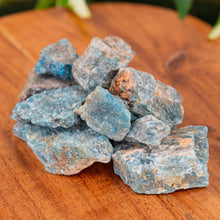 Load image into Gallery viewer, Blue Apatite Raw on a wooden surface close up - Down to Earth
