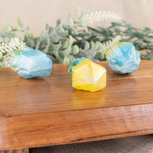 Load image into Gallery viewer, Blue &amp; Yellow Aura Quartz Point side facing on a style background - Down To Earth
