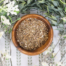 Load image into Gallery viewer, Ceridwen's Vervain Herbs in a bowl with plants on a style background - Down To Earth
