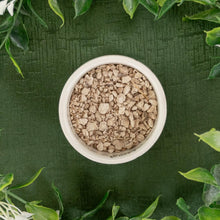 Load image into Gallery viewer, Ceridwen's Herbs High John Root top down in a bowl displayed on a styled background - Down to Earth
