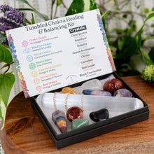 Load image into Gallery viewer, Chakra Balancing &amp; Healing Kit Tumbled on a wooden surface styled photo slight left angle - Down to Earth
