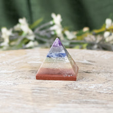 Load image into Gallery viewer, 35mm Chakra Pyramid side facing with flowers on a style background - Down To Earth
