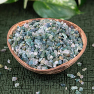 Green Moss Agate Crystal Chips in a coconut shell styled photo - Down to Earth