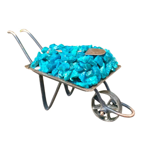 Chrysocolla Crystal Chips inside a metal wheelbarrow - Down To Earth