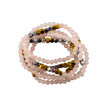Load image into Gallery viewer, "Stack of beaded bracelets with pink, gold, and silver beads on a white background," - Down to Earth.
