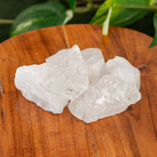 Load image into Gallery viewer, Clear Quartz Raw on a wooden surface high angle - Down to Earth 
