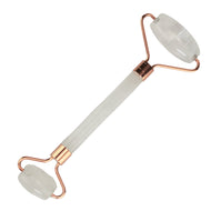 Clear Quartz Crystal Facial Roller on a white background - Down To Earth