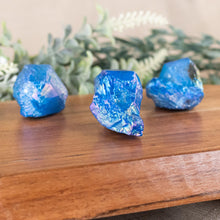 Load image into Gallery viewer, Cobalt Aura Quartz Point side facing on a style background - Down To Earth
