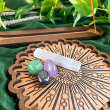Load image into Gallery viewer, "Decorative Crystal Grid Incense Holder with crystals on top of the product on a green sheet with foliage in the background," - Down to Earth.

