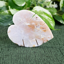Load image into Gallery viewer, Crystal Leaf Cherry Agate displayed on a styled background - Down To Earth

