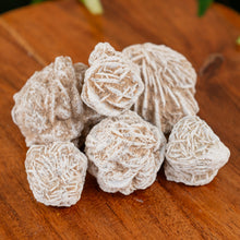 Load image into Gallery viewer, Desert Rose on a wooden surface close up - Down to Earth 
