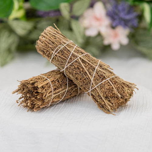 Desert Sage Bundle on a white cloth with flowers in the background - Down to Earth 