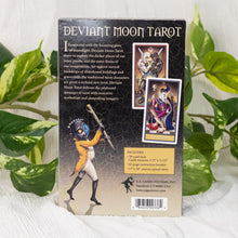 Load image into Gallery viewer, Deviant Moon Tarot Deck backside of the box on a style background - Down To Earth
