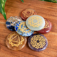 Load image into Gallery viewer, "Set of stones with geometric patterns on a wooden surface," - Down to Earth.
