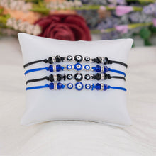 Load image into Gallery viewer, Evil Eye Knotted Bracelets Colors on a Small Pillow - Down To Earth
