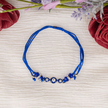 Load image into Gallery viewer, Dark Blue Evil Eye Bracelet Knotted Top Down Shot Styled  - Down To Earth
