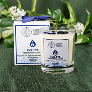 Evil Eye Protection Candle with packaging displayed on a styled background - Down To Earth