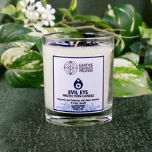 Load image into Gallery viewer, Evil Eye Protection Candle with plants displayed on a styled background - Down To Earth
