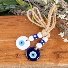 Load image into Gallery viewer, Evil Eye Mobile Hanger Group Picture with brown and flower background - Down To Earth
