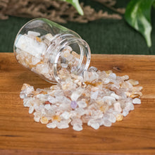 Load image into Gallery viewer, Flower Agate Crystal Chips 1lb front facing in a jar displayed on a styled background - Down To Earth
