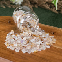 Load image into Gallery viewer, Flower Agate Crystal Chips 1lb top down angled in a jar displayed on a styled background - Down To Earth
