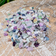 Fluorite Crystal Chips on a wooden surface styled photo - Down to Earth