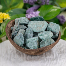 Load image into Gallery viewer, Fuchsite Raw side angle in a coconut shell - Down To Earth
