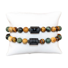 Load image into Gallery viewer, "Two Gemini Zodiac Bracelets that showcase the astrological symbol on a white background," - Down to Earth.
