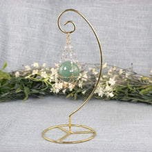 Load image into Gallery viewer, Sphere Holder Stand gold with sphere displayed on a styled background - Down To Earth
