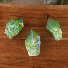 Load image into Gallery viewer, Green Aura Quartz Point top down on a style background - Down To Earth
