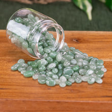 Load image into Gallery viewer, Green Aventurine Chips 1lb top down angled in a jar displayed on a styled background - Down To Earth
