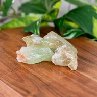 Green Calcite Raw 1lb on a wooden surface - Down to Earth