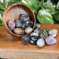 Green Moss Agate Tumbled 1lb up close front facing on a styled background - Down To Earth