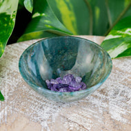 Small Green Moss Agate Bowl on a wooden surface with amethyst chips inside styled photo - Down to Earth