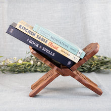 Load image into Gallery viewer, Hand Carved Wooden Book Holder with books front facing displayed on a styled background - Down To Earth
