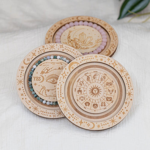Group of Wooden Jewelry Holders on a white cloth - Down to Earth