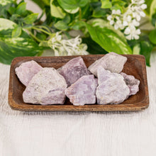 Load image into Gallery viewer, Kunzite Raw displayed on a colorful background - Down to Earth
