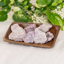 Load image into Gallery viewer, Kunzite Raw displayed on a colorful background side angle - Down to Earth

