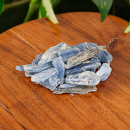 Blue Kyanite Blade on a wooden surface - Down to Earth 