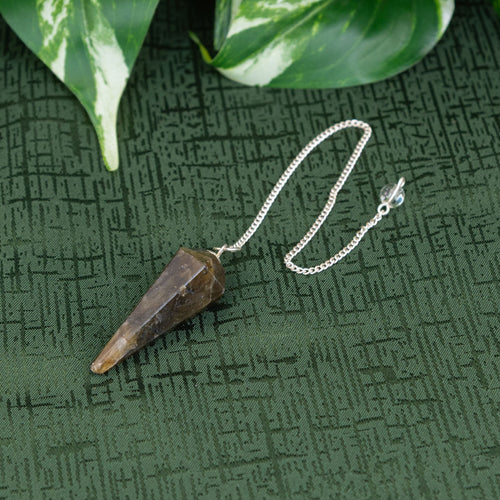 Labradorite Pendulum on a green cloth - Down to Earth