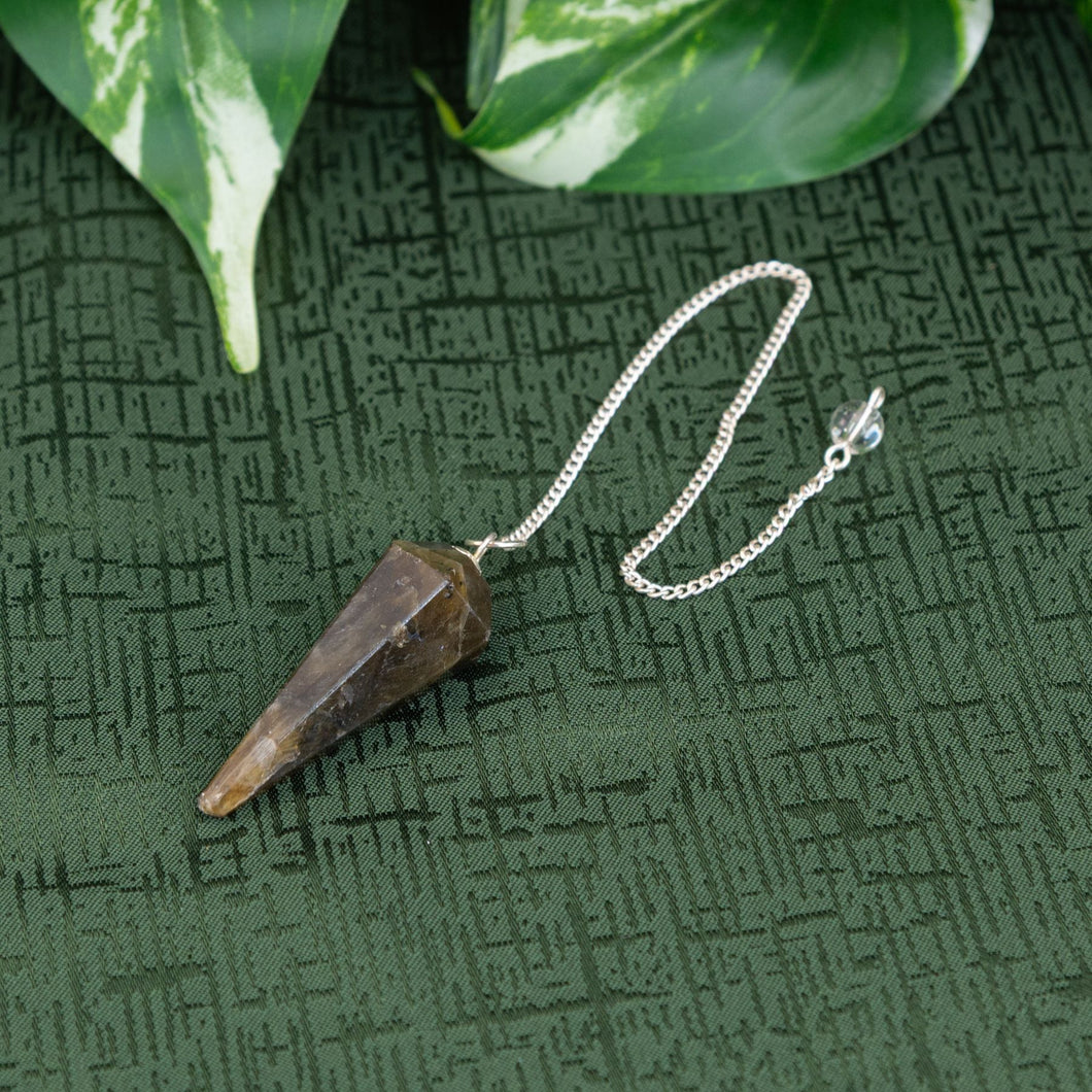 Labradorite Pendulum on a green cloth - Down to Earth