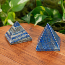 Load image into Gallery viewer, 2" Lapis Pyramid on a wooden surface with a green background - Down to Earth

