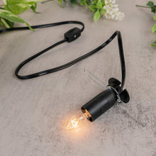 Load image into Gallery viewer, Large Lamp Cord &amp; Bulb displayed on a colorful background while being lit close up angle - Down to Earth
