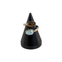 Load image into Gallery viewer, "Amber &amp; Larimar Sterling Silver Ring on a black cone stand on top of a white background," - Down to Earth.
