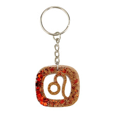 Load image into Gallery viewer, Leo Glitter Resin Keychain on a white background - Down To Earth
