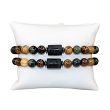 Load image into Gallery viewer, "Two Libra Zodiac Bracelets on a white pillow," - Down to Earth.

